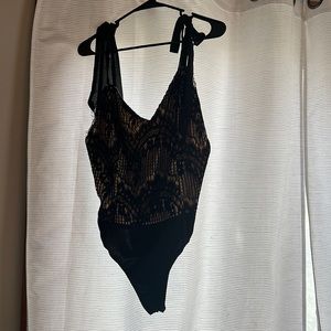 Nude and black body suit. Size XL.